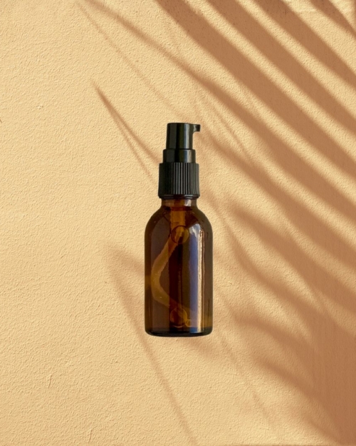 Decorative Image of Amber Bottle with treatment pump for Ready to Label Muscle Lotion.