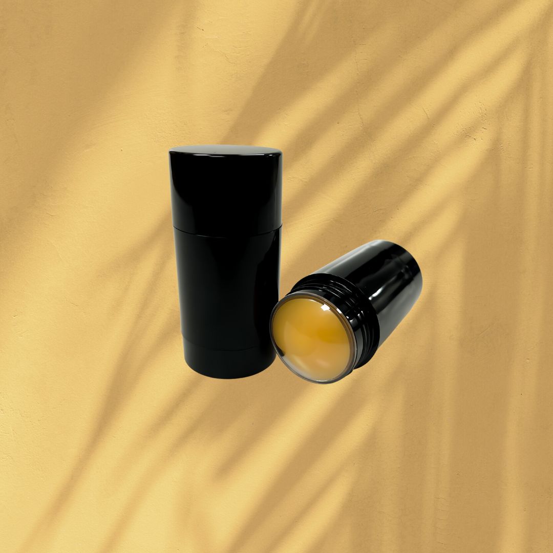 Decorative Image of Orange Muscle Rub Inside a black cylinder deodorant tube.